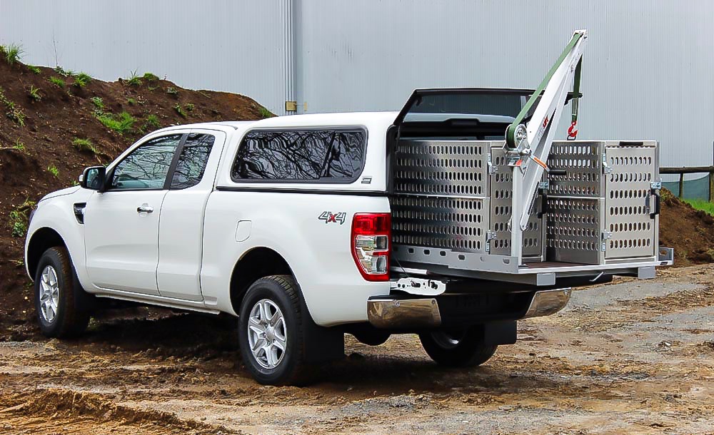Pick up truck with Manual Spitzlift Crane on slide out bed